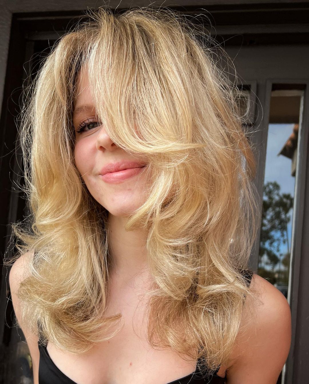 Blonde butterfly haircut