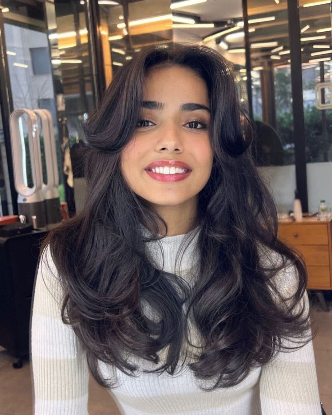 Butterfly cut with curls on black hair