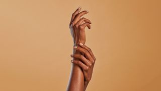 arms with nude polish
