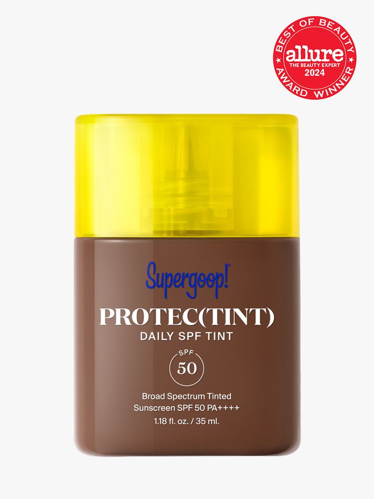 sunscreen in branded clear bottle with yellow cap on light gray background with red and white 2024 allure best of beauty seal